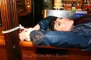 Jill tied and gagged in shiny rainwear