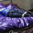Samantha tied and gagged on bed wearing a shiny darkblue nylon rain pants and a light blue rain jacket (Pics)