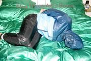 Jill tied, gagged and double hooded on a bed wearing supersexy oldschool rainwear (Pics)