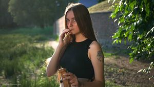 18 y.o. Margarita is smoking three cork 120mm cigarettes outdoors