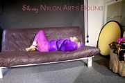 *** HOT HOT HOT*** NEW MODELL*** SANDRA wearing a sexy transparent purple shiny nylon pants and a purple down jacket tied and gagged on a sofa with ropes hand to feet and a cloth gag (Pics)