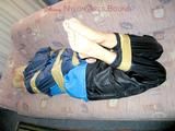Archive girl tied and gagged with tape and rope wearing shiny nylon rainwear in blue (Pics)