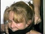 38 Yr OLD CASHIER ATTIC BOUND & GAGGED IN A BLACK LEATHER DRESS (D24-6)