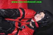 Sexy PIA wearing a sexy blue rainbib and a black/red shiny nylon rainjacket being tied, gagged and hooded on a chair with ropes and a ballgag (Pics)