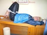 Archive girl tied and gagged with tape and rope wearing shiny nylon rainwear in blue (Pics)