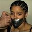 18 Yr OLD STUDENT SHANNA IS WRAP TAPE GAGGED, DUCT TAPE TIED, BAREFOOT, TOE-TIED, HANDCUFFED, MOUTH STUFFED, HANDGAGGED WHILE SITTING ON THE BED (D67-15)