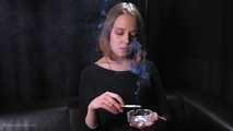 Dasha is smoking in the studio