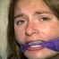 24 Yr OLD CRAFTER IS BLINDFOLDED, CLEAVE GAGGED WITH WRAP AROUND VET TAPE, BALL-TIED,CROTCH ROPED, BAREFOOT, TOE-TIED, GAG TALKING THROUGH A WET DROOL GAG, HOPS AROUND WEARING A SEXY BIKINI (D70-9)