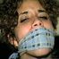 SWEET LATINA MARIE IS BALL-GAGGED, OTM-GAGGED, WRISTS-GAGGED, CLEAVE-GAGGED, MOUTH STUFFED & HANDGAGGED (D48-4)