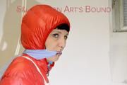 Mara tied, gagged and hooded in a cellar wearing sexy shiny nylon down pants and down jacket (Pics)