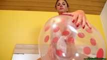 red fingernail popping of seven balloons