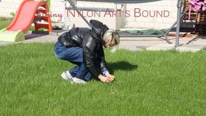 Sexy Ronja wearing sexy shiny nylon downwear in the garden (Pics)