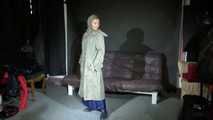 Watching sexy Sandra wearing a supersexy long rainwear skirt trying on several rain coats with hoods (Video)