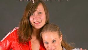 Alina and a friend of her posing infront of a camera both wearing sexy shiny nylon jumpsuits (Pics)