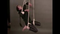 4 short videos in one of an beautiful black haired archive girl tied and gagged on the floor wearing sexy shiny nylon rainwear (Video)