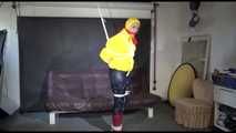 MARA tied and gagged overhead with ropes and a ballgag wearing a super sexy super shiny black rain pants, rubber boots and a yellow down jacket (Video)