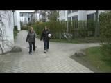 Katharina and her friend wearing shiny nylon rainwear while playing soccer (Video)