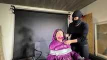 Rachel Adams caught, bound and gagged in a shiny nylon Downjacket