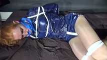 ***RONJA*** being tied and gagged on a sofa with ropes and a clothgag wearing a sexy blue shiny nylon shorts and a rainjacket (Video)