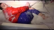Jill ties and gagges herself in a bath tub for having an extraordinary experience wearing a sexy lightblue rainpants and an orange down jacket (Video)