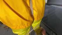 Ms Ungeniert tied and gagged in shiny nylon Rainwear trying to escape