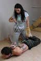 Hazel dominates Gregory, bit-gagged and hogtied with his hands in reverse prayer