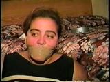 24 YR OLD LATINA HOUSEWIFE MOUTH STUFFED, WRAP TAPE GAGGED, BAREFOOT & TOE TIED (D61-11)
