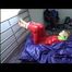 Samantha tied and gagged on bed wearing a shiny red sauna suit (Video)
