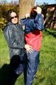 Jill and her friend in the garden playing with eachother wearing sexy shiny nylon rainwear (Pics)