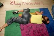 Stella posing in a living room wearing supersexy rainwear (Pics)