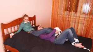 Catt and Alexa - Naughty girl tied up before joining powerless girlfriend on the bed