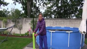 Watch Sandra enjoying Shower in her shiny nylon Downwear in the Garden