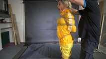 Ms Ungeniert tied and gagged in shiny nylon Rainwear trying to escape