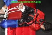 Sexy PIA wearing a sexy blue rainbib and a black/red shiny nylon rainjacket being tied, gagged and hooded on a chair with ropes and a ballgag (Pics)
