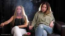 Two friends are smoking sitting on the sofa in this smoking fetish video