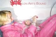 Sonja ties and gagges herself in the bath tub with cuffs wearing sexy shiny nylon downwear (Pics)