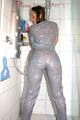 Stella wearing a supersexy grey rainwear catsuit under the shower (Pics)