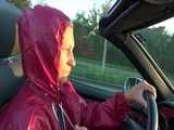 Watch Sandra taking a Walk during very hot Weather enjoying her rubberized oldschool Rainsuit