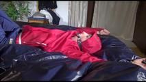 Sonja tied and gagged on bed with cuffs wearing a sexy rainwear combination (Video)