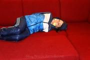 Isabelle tied and gagged in shiny nylon clothes