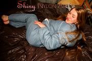 Katharina posing on a bed wearing a supersexy grey-blue downwear combination (Pics)