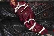 Lucy tied, gagged and hooded on a sofa wearing a sexy darkred downwear combination (Pics)