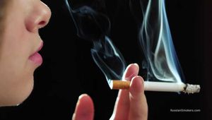 A young lady showing her smoking skills in a closeup video 