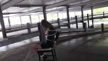 Stella on chair at car park 2/2