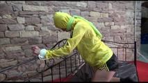 Pia tied and gagged on a princess bed wearing a sexy black nylon shorts and a yellow rain jacket (Video)