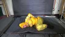 Ms Ungeniert tied and gagged in shiny nylon Rainwear trying to escape