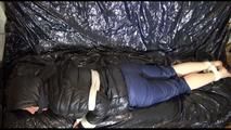 Mara tied, gagged and hooded on a sexy black covered sofa wearing a supersexy black down jacket and rain pants (Video)
