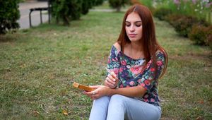 Christine is smoking cork cigarettes one by one
