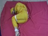 two short videos with our archive girls tid and gagged in shiny nylon rainwear