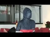 03:40 Min. video with Nicole tied and gagged in shiny nylon rainwear